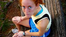 Mary Erin Imwalle rests on a bench. The sixth best runner in the region considers self-doubt racings biggest obstacle.