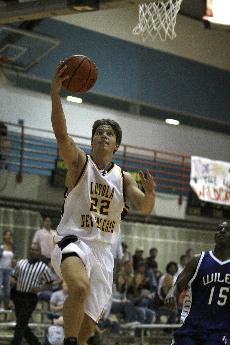 Psychology junior guard Luke Zumo elevates for a layup against Wiley College on Thursday night at The Den. 