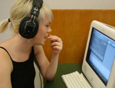 Tara Curtis, music industries studies sophomore, records voice tracks for her radio program All the Songs in My Head.
