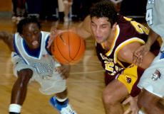 Loyola forward Mario Faranda tussles with UNO's Shaun Reynolds for a loose ball on Tuesday in The Chamber at UNO. Faranda scored 19 points and grabbed 10 boards but UNO won 78-59.