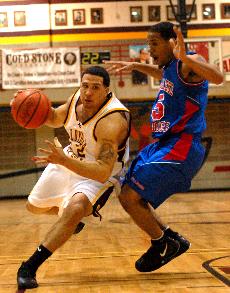 Guard Torry Beaulieu, history sophomore, rounds a Tougaloo defender on the dribble at The Den on Saturday night. Beaulieu amassed 13 points but realizes his team will need more scorers if they are to win consistently.