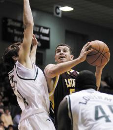 Senior guard James Bunn draws contact from Tulane's Daniel Puckett in an exhibition Nov. 21, 2006. Bunn is a top defender.