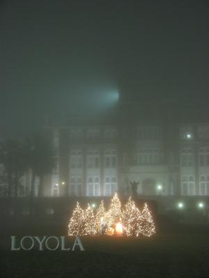 The lights of the Horseshoe Christmas trees and Marquette Hall glow in a thick blanket of fog that settled across the city Tuesday evening.