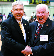 Track lends Fritz Westenberger (left) and Harold Chauvin (right) embrace after the Hall of Fame ceremony at the Den on Feb. 10. Chauvin set records in the mile, the 2-mile and the 880-yard events in his time running for Loyola. both men were staples of Loyolas golden age of track in the 1950s.