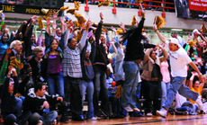 A mob of Wolfpack supporters orchestrates a wave in teh bleachers at mondays championship showdown against Xavier.