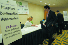 A student confirms his interview meeting at the Mardi Gras Career Fair on Friday. Career Services is undergoing an upgade, and plans to collaborate with other universities.