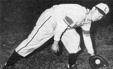 Russ Cresson fields a groundball at shortstop. He lettered a te position for Wolfpack baseball in 1946.