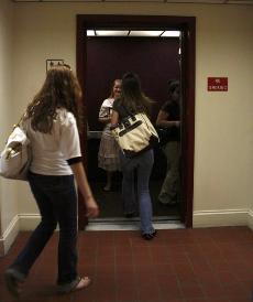 Students enter one of the slowest elevators on Loyolas campus