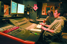 Music Industry sophomore glenn MacRae and Music Business junior Marley Lovell take advantage of the recording studio.
