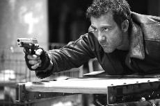 Consistently leather-clad Clive Owen stars in the over-the-top action flick "Shoot 'Em Up," opening nationwide Sept. 7.