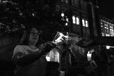 Participants of the 16th Take Back the Night light candles in preparation for a night-time sojourn to Loyola's Broadway campus.