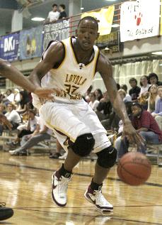 McArthur Strickland drives against a Wesley College defender.