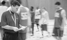 Joey Stiebing, Loyola assistant basketball coach, studies the game plan during practice. Steibing faces University of New Orleans, where he was once the head coach, on Saturday.