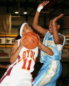 Management sophomore guard Trenese Smith wrestles for a basket agianst SUNO on Jan. 19.