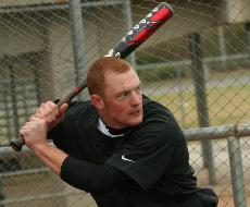 Sam Dodge, general business studies freshman, stares down a pitch in practive. he will solidify infield depth.