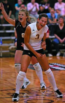 Tiffany Stafford, right, and Keelyn Henderson, international business sophomore, gleefully holler after a win over Belhaven in this file photo form Sept. 8, 2007.