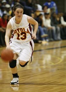 Kiely Schork dribbles up the court duringa March 11 loss.