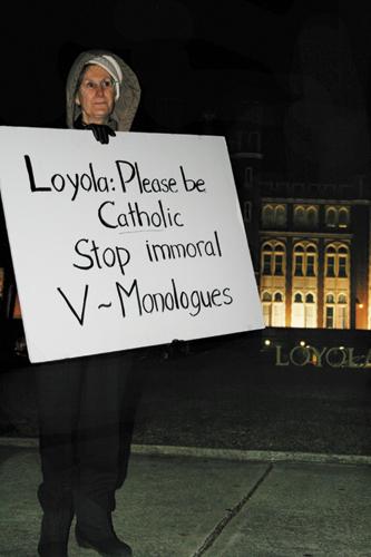 A woman shows distaste for Loyolas production of The Vagina Monologues. A group gathered in prayerful protest March 4.