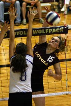 Mary Seals spikes the ball over the net against Spring Hill College in the second set on Sept. 23 at the Den.