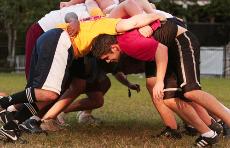 The Loyola rugby team mauls during practice on Oct. 1 in the Residential Quad. The team is now a mix of both new and veterean players, which team memebers believ brings balance to the club.