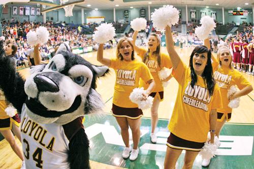 Havoc and the cheerleaders perform a chant to exite the crow during the Loyola vs. Tulane game at the Fogelman Arena.
