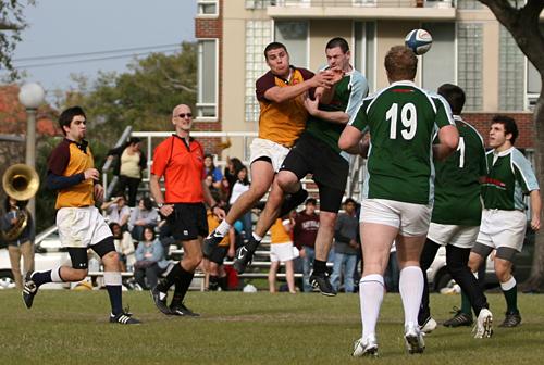 General studies/business sophomore Alexander West, far left, rushes in as Loyola rugby player Matt Roden collides with a Tulane rugby team member on Jan. 17.