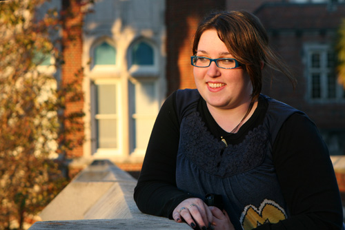 Tracey Kinamore sits outside of Marquette Hall.