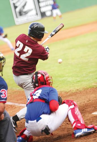 Pitcher Troy Collins sends the ball into play during the Wolfpack's win over Tougaloo. (Photo by Dan Helfers/The Maroon)