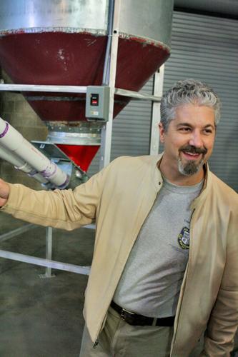 Owner Kirk Coco describes the brewing process in front of NOLA's brand new fermenting machines. Brewing is scheduled to start this week. (Photos by Dan Helfers/The Maroon)