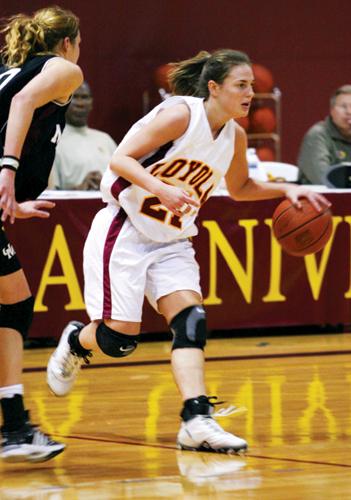 Management senior and forward guard Christine Mainguy makes her way to the goal at the GCAC Quarterfinals against Mobile on March 4. The Lady ’Pack won 80-62.