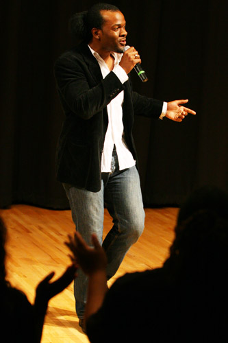 Gospel aratist and preacher Levy Q gets the audience on their feet, clapping and singing along to his original songs at the Gospel Explosion in Nunemaker Hall Feb. 26.