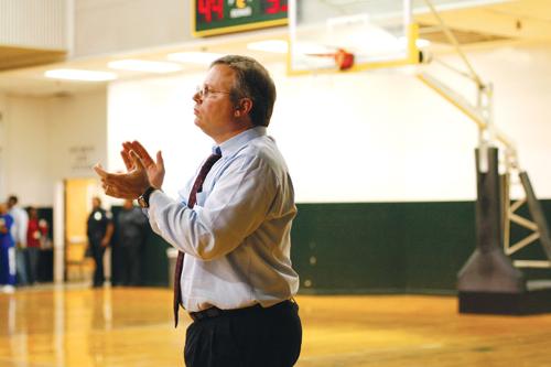 Michael Giorlando, men’s basketball coach, cheers his team on during a game. Giorlando led  his team to their best season since taking over in 2004 with a 19-11 record.