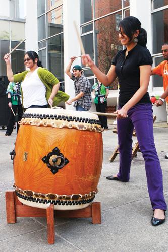 Biology senior, Puja Cuddapah beats the drum during the St. Louis Osuwa’s Taiko dance. The Festival of Light featured many acts like this that gave students knowledge on Asian culture.