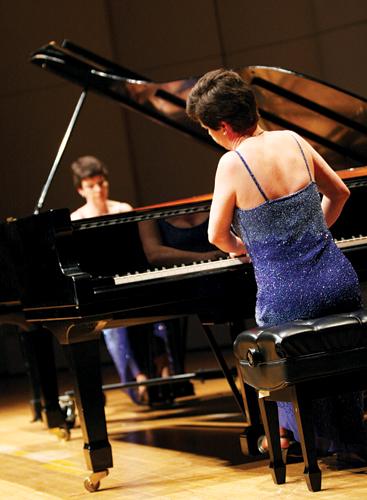 Pianists Claire and Antoinette Cann play two-piano accompaniments in Roussel Hall March 13. 