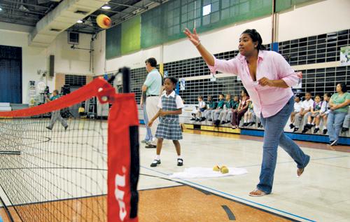 Music performance junior Alexcia Plummer tosses a ball to a student at Hynes Elementary School. Plummer has worked with the school since February for her sociology class.