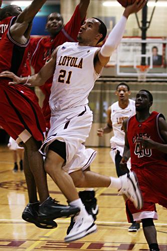 Ryan Brock, management sophomore, goes for a lay up against William Carey University in the Hall of Fame game on Feb. 28 in the Den.