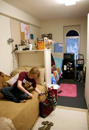 Mass Communication sophomore Courtney Mattison visits friends in a Cabra dorm room after she moved in last week.