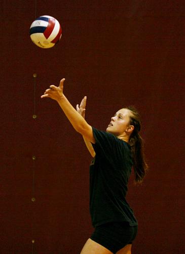 General studies business sophomore Lindsey Mullinix serves the ball during a volleyball practice in the Den Tuesday, Sept. 1. 