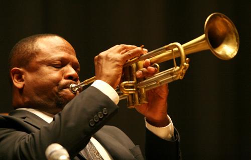 A trumpet player performs in a band with clarinetist Michael White and vocalist John Boutté at the opening event of the Center for the Study of New Orleans in Nunemaker Hall