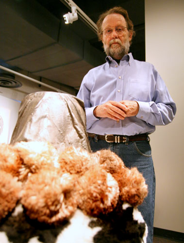 Visual arts professor Mark Grote poses next to one of his sculptures on display in the Collins C. Diboll Art Gallery Thursday, Sept. 10.