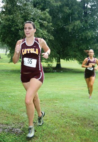 Lauren Fereday, biology studies sophomore, paces herself in the Wolfpack Invitational Cross Country meet. The Lady Wolfpack placed first in the Invitational Cross Country meet. The Lady Wolfpack placed first in the Invitational Sept. 12 at Lafreniere Park