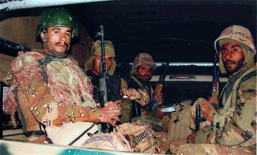 n this undated photo released by the Yemeni Army on Wednesday, Sept. 16, 2009, Yemeni government soldiers are seen riding in the back of a truck in Saada province, Yemen. Yemeni warplanes on Wednesday hit a makeshift camp for civilians fleeing fighting between the government and Shiite rebels, killing dozens of people, witnesses said