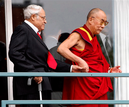 The Dalai Lama, right, holds the hand of Rev. Benjamin Hooks as they walk on the balcony of the Lorraine Motel Wednesday, Sept. 23, 2009, in Memphis, Tenn., after visiting the spot where Rev. Martin Luther King Jr. was assassinated in 1968. Hooks is a former executive director of the NAACP. The Dalai Lama is in Memphis to accept the 2009 International Freedom Award from the National Civil Rights Museum
