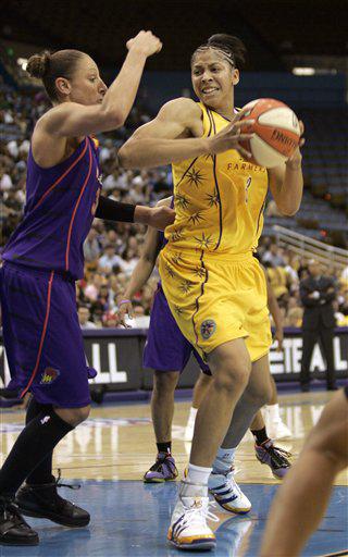 Los Angeles Sparks' Candace Parker, right, looks to shoot against Phoenix Mercury's Diana Taurasi during the third quarter of Game 1 of the WNBA basketball Western Conference finals at UCLA's Pauley Pavilion in Los Angeles on Wednesday, Sept. 23, 2009.