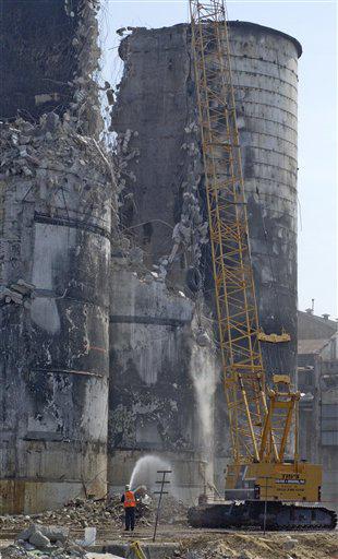 crane swinging a 7000 lb. ball continues the demolition of the 3 100-foot-tall silos at the Imperial Sugar Refinery in Port Wentworth, Ga., damaged in a 2008 explosion.