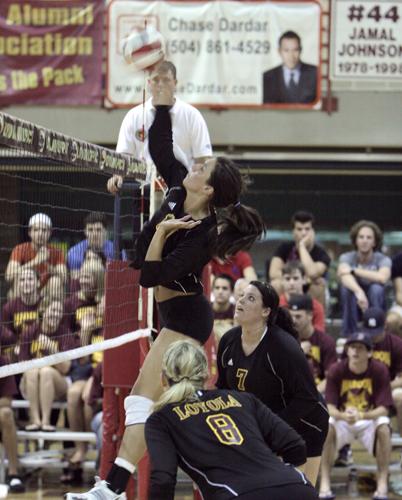 Rachel Roth, general studies business freshmen,spikes the ball as the Wolfpack defeated Belhaven on Sept. 22.