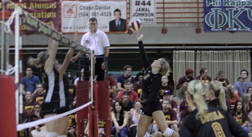 Ashley England, English sophomore, attempts to tip the ball over the net during their match against Belhaven on Sept 22.