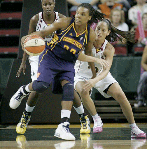 Connecticut Sun's Tan White backs down Seattle Storm's Sue Bird, right, in the first half of a WNBA basketball game at Key Arena, Thursday, Aug. 27, 2009, in Seattle.