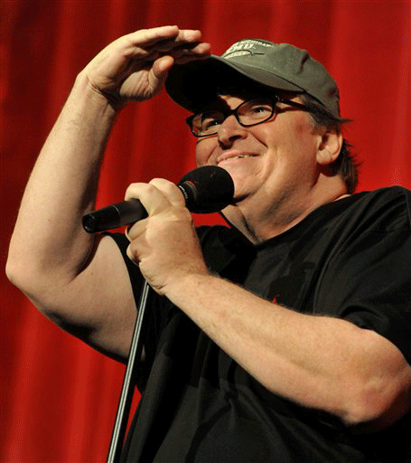 In this July 28, 2009 image, actor/director and Oscar-winner Michael Moore addresses a theatre full of movie fans at the Traverse City Film Festival, in Traverse City, Mich. Moore is a co-founder of the five-year-old, week-long festival in Traverse City.