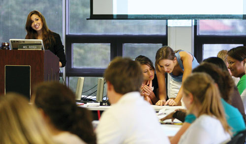 Student Government Association vice president and English junior Maria Rossi, left speaks to College of Business president and finance senior Jonathan Rowan, seated at table, as chief of staff and mass communication sophomore Kate Gremillion discusses an issue with the president and marketing junior Sarah Cooper, center at a student government meeting Tuesday, Sept. 29.
